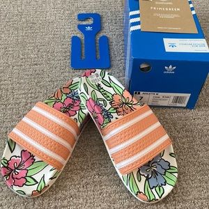Super cute, never worn adidas slides. Floral pattern foot bed. Peach top. Size 7
